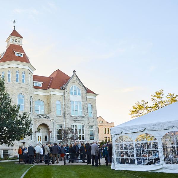 An event with a large tent on main lawn